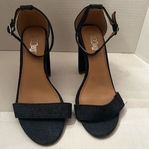 Brash ankle-strap block-heel sandals in blue denim with a 4" heel.